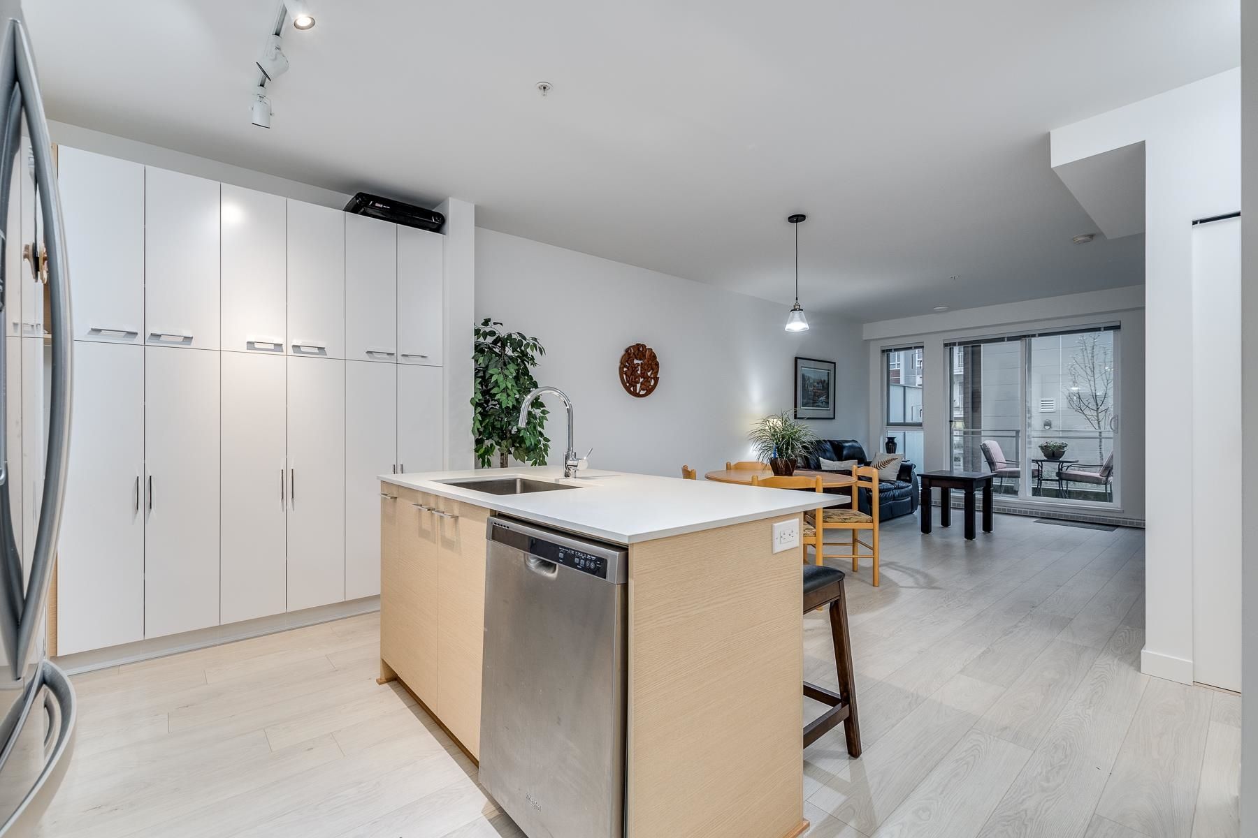 Main Photo: 106 13963 105 Boulevard in Surrey: East Newton Condo for sale in "HQ DWELL" : MLS®# R2632896